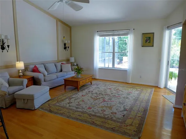 a living room with furniture and a rug