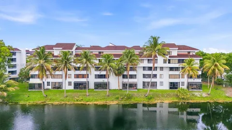 a view of building with river in front of it