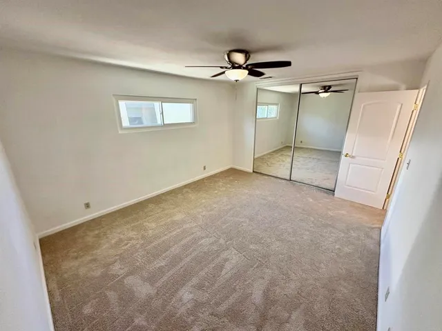 a bathroom with a sink toilet a mirror and shower