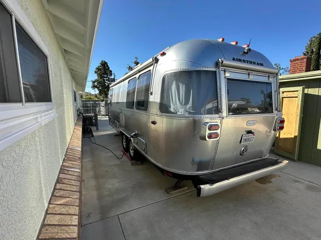 a view of a house with a wooden deck
