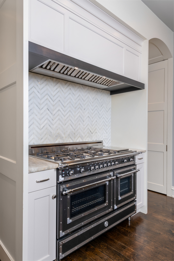 41 East Elm Street Chicago, IL 60611 - Photo 16 of 50 a stove top oven sitting inside of a kitchen