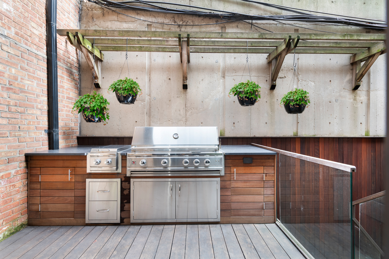 41 East Elm Street Chicago, IL 60611 - Photo 19 of 50 a kitchen with a white wooden floor and white cabinets