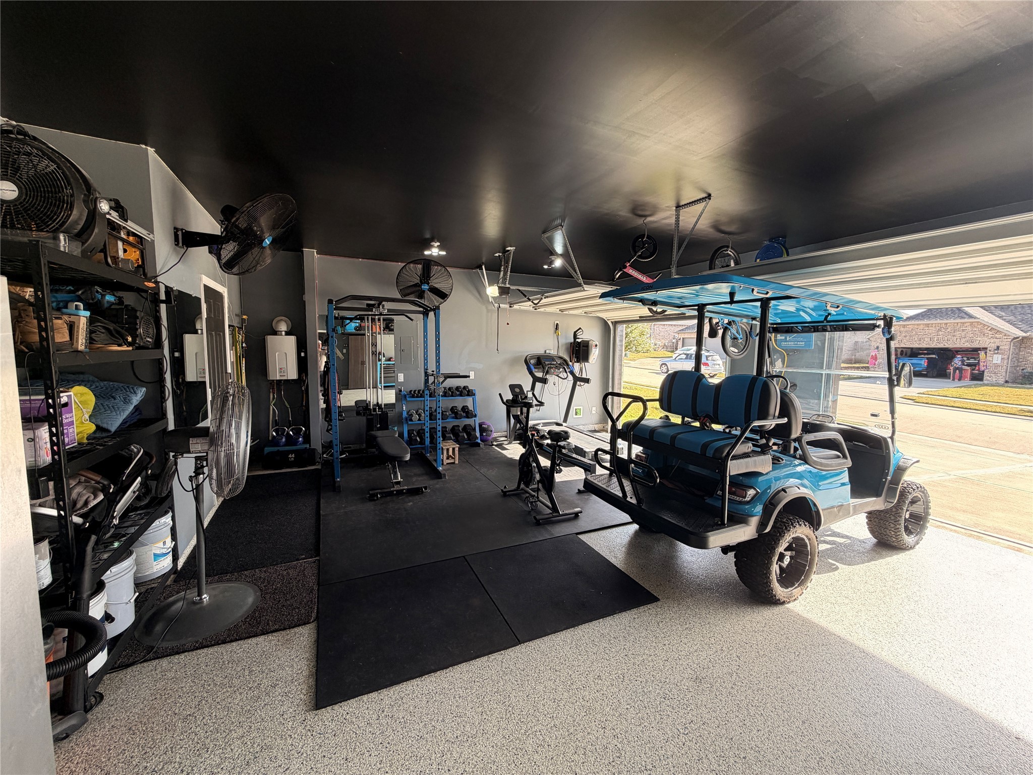 443 Stonebrook Lane Conroe, TX 77304 - Photo 16 of 21 Epoxy Garage Floor Oversized 3 Car with Built-in Racks and more.