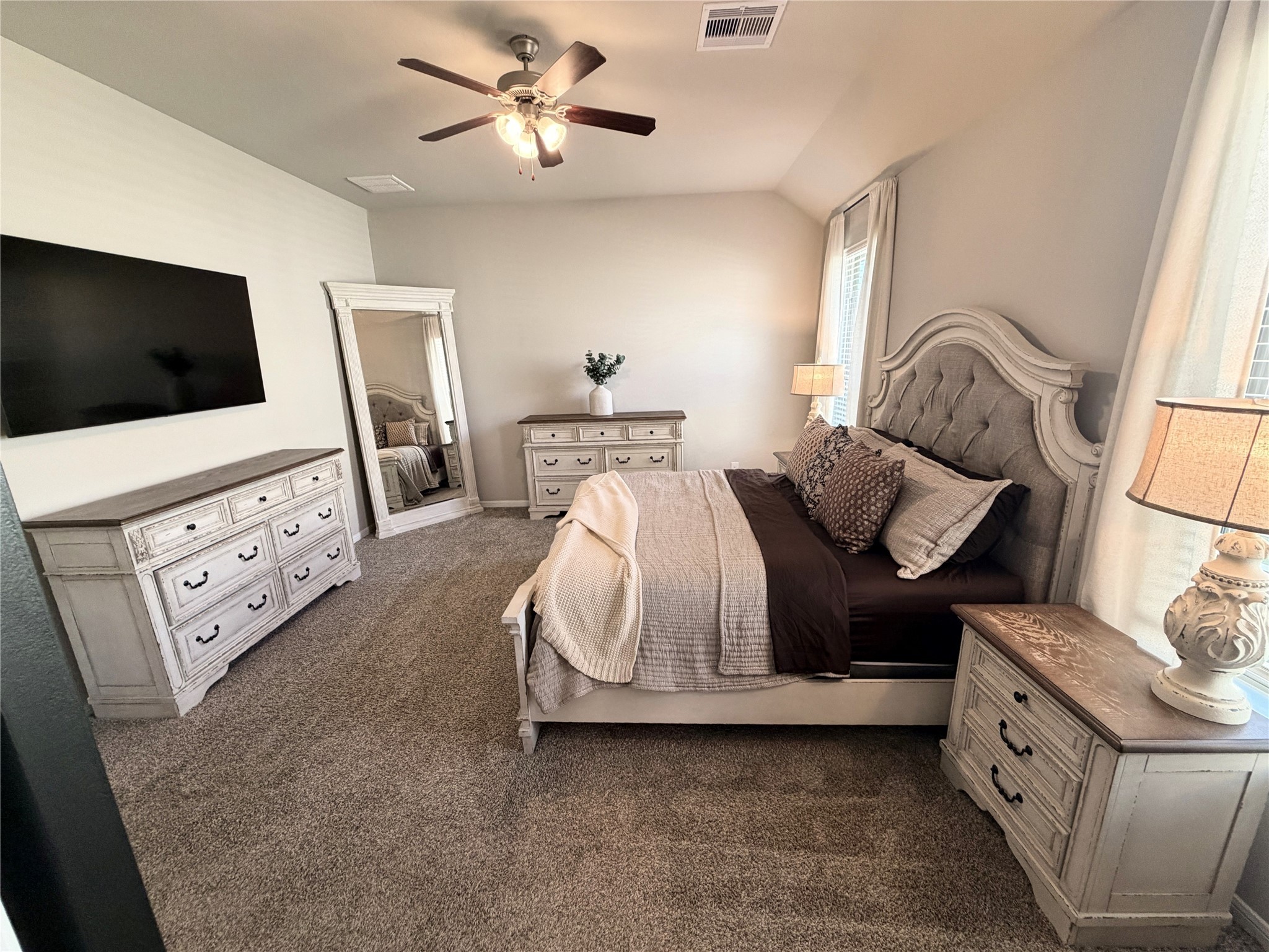 443 Stonebrook Lane Conroe, TX 77304 - Photo 5 of 21 17 Feet of Relaxing Bedroom Suite with Natural light, Ceiling Fan and a Spa bathroom.