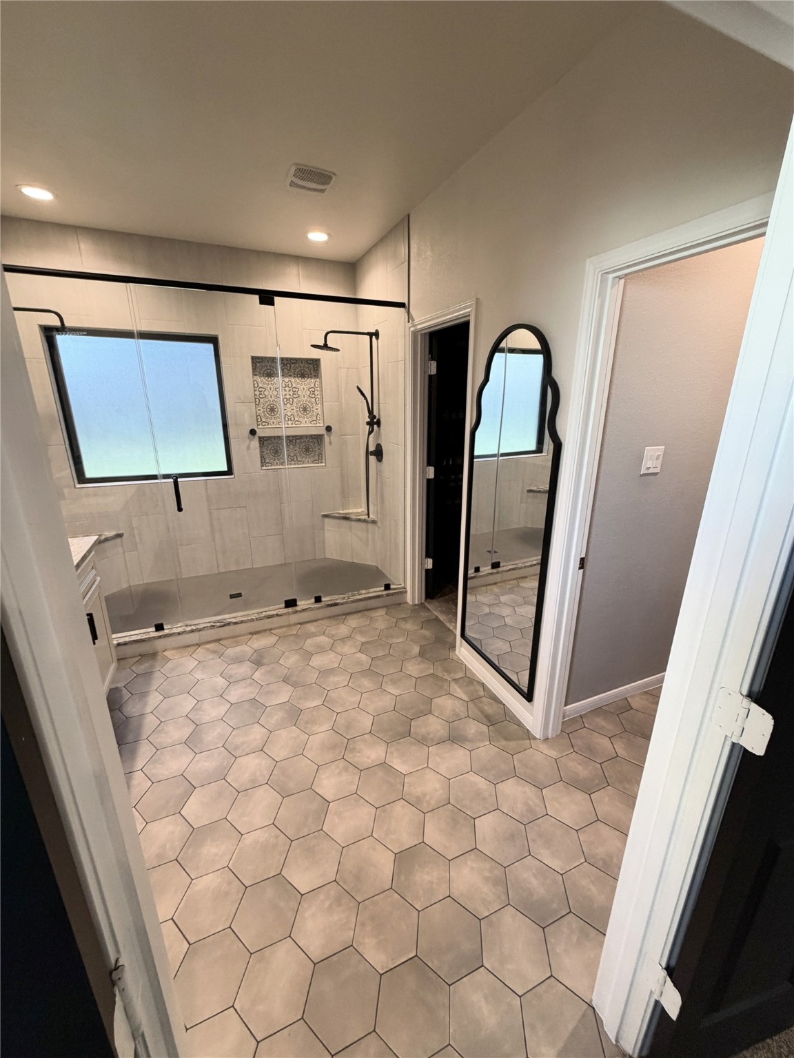 443 Stonebrook Lane Conroe, TX 77304 - Photo 9 of 21 Spa style Primary with easy access extra large custom two sides of shower heads to position for the ultimate shower.