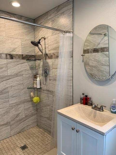 527 Eastview Road Largo, FL 33770 - Photo 8 of 14 a bathroom with a sink and a mirror