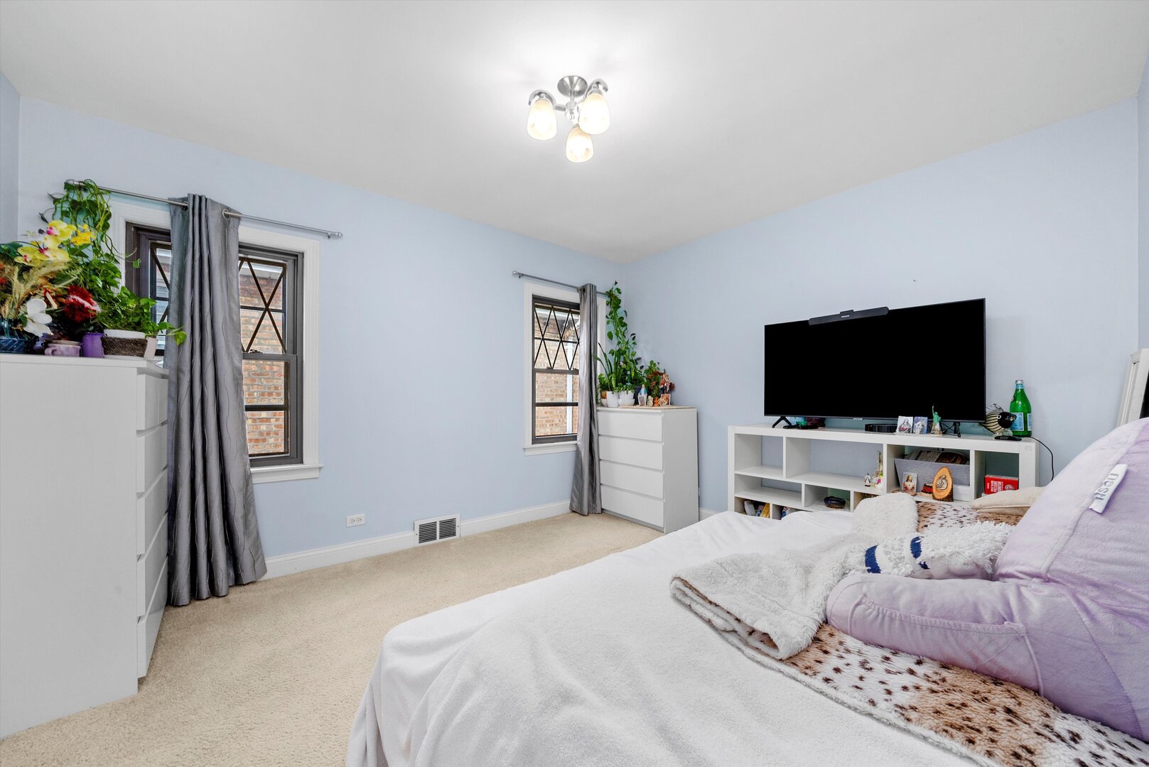 5009 South Kostner Avenue Chicago, IL 60632 - Photo 15 of 41 a bedroom with a bed and a flat screen tv