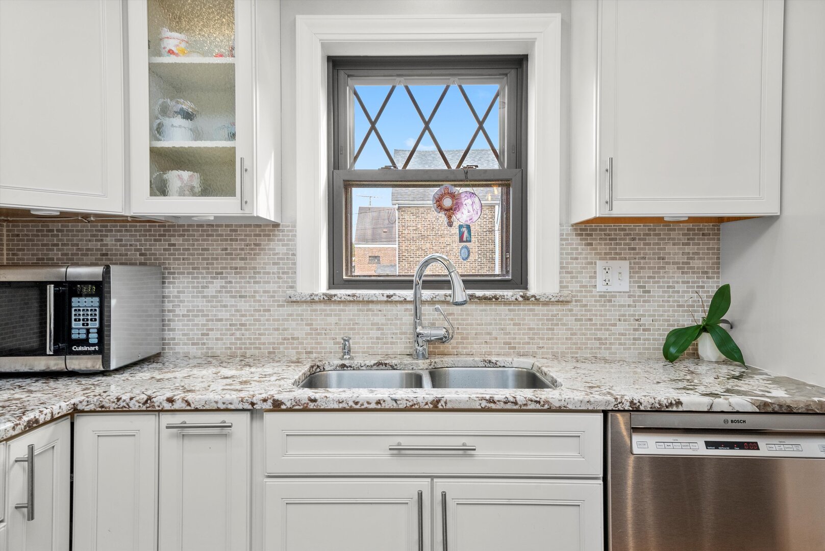 5009 South Kostner Avenue Chicago, IL 60632 - Photo 22 of 41 a kitchen with granite countertop a sink and a stove