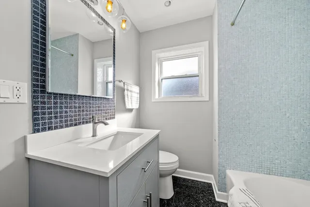 a bathroom with a sink and a toilet