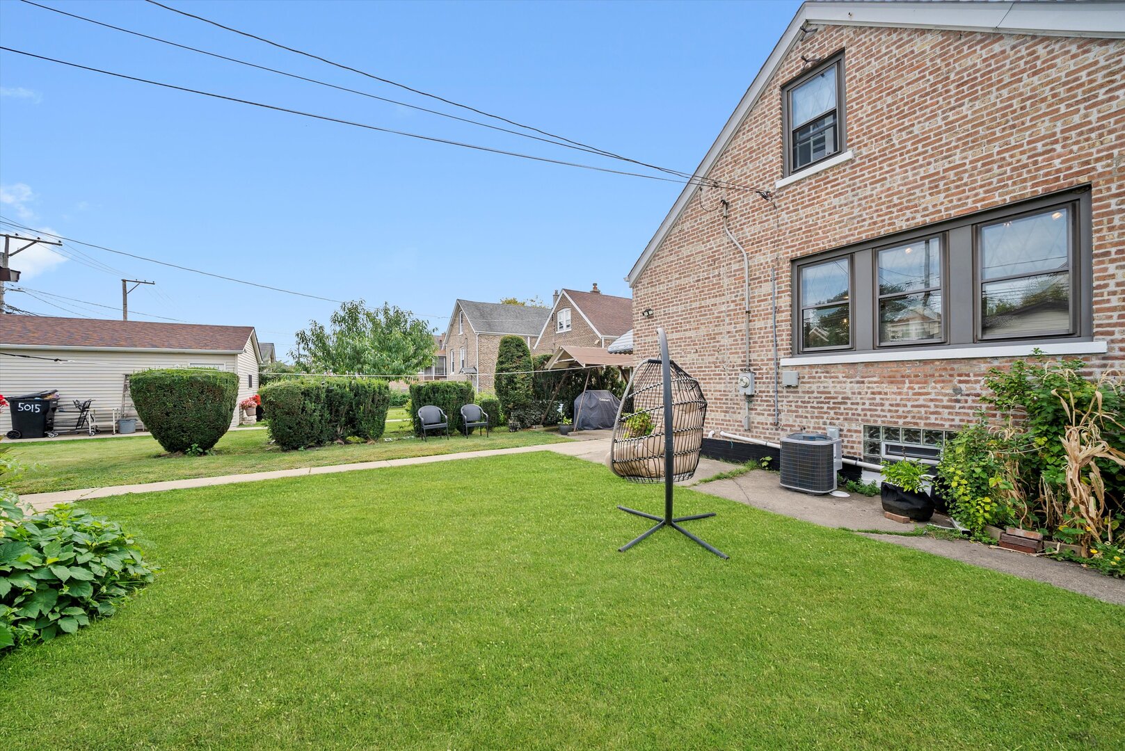 5009 South Kostner Avenue Chicago, IL 60632 - Photo 36 of 41 a view of a house with a yard porch and sitting area