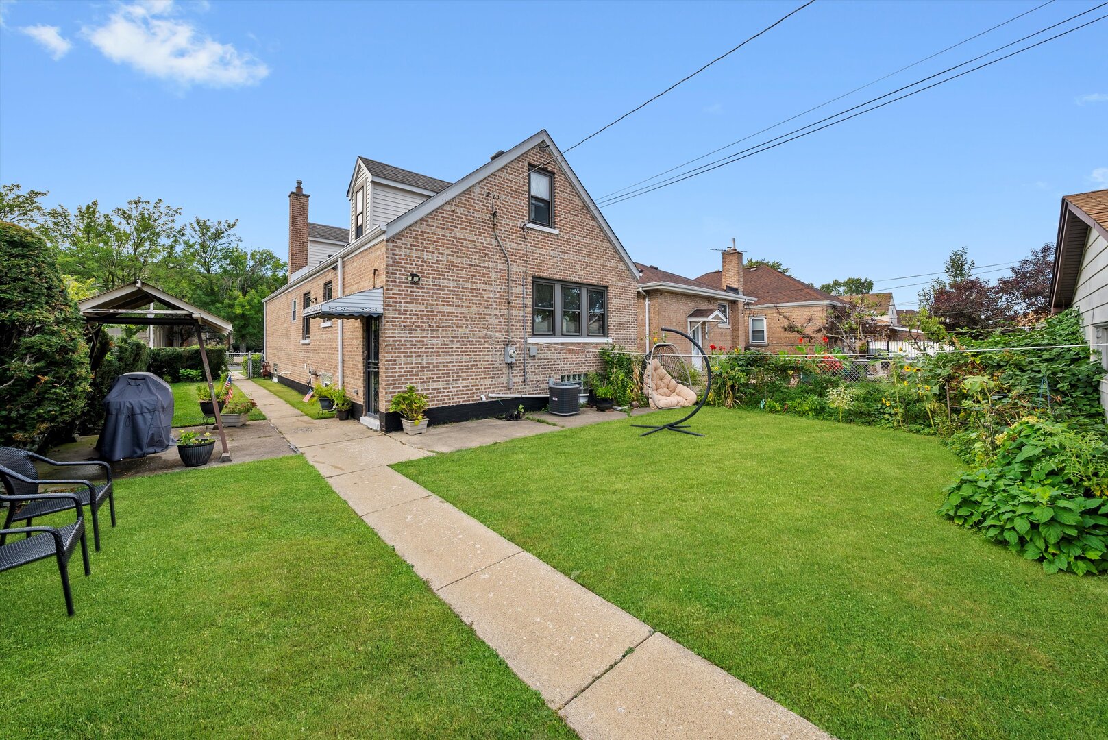 5009 South Kostner Avenue Chicago, IL 60632 - Photo 37 of 41 a front view of house with yard and green space