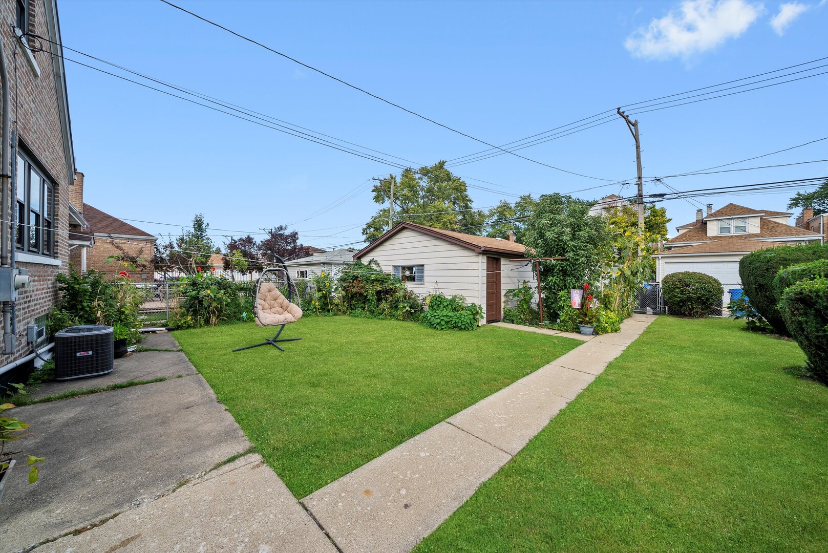 5009 South Kostner Avenue Chicago, IL 60632 - Photo 40 of 41 a house view with a garden space