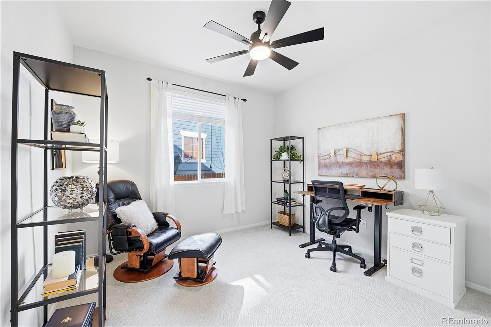 10468 Wagon Highlands Ranch Littleton, CO 80130 - Photo 18 of 48 a view of a workspace with furniture and a window