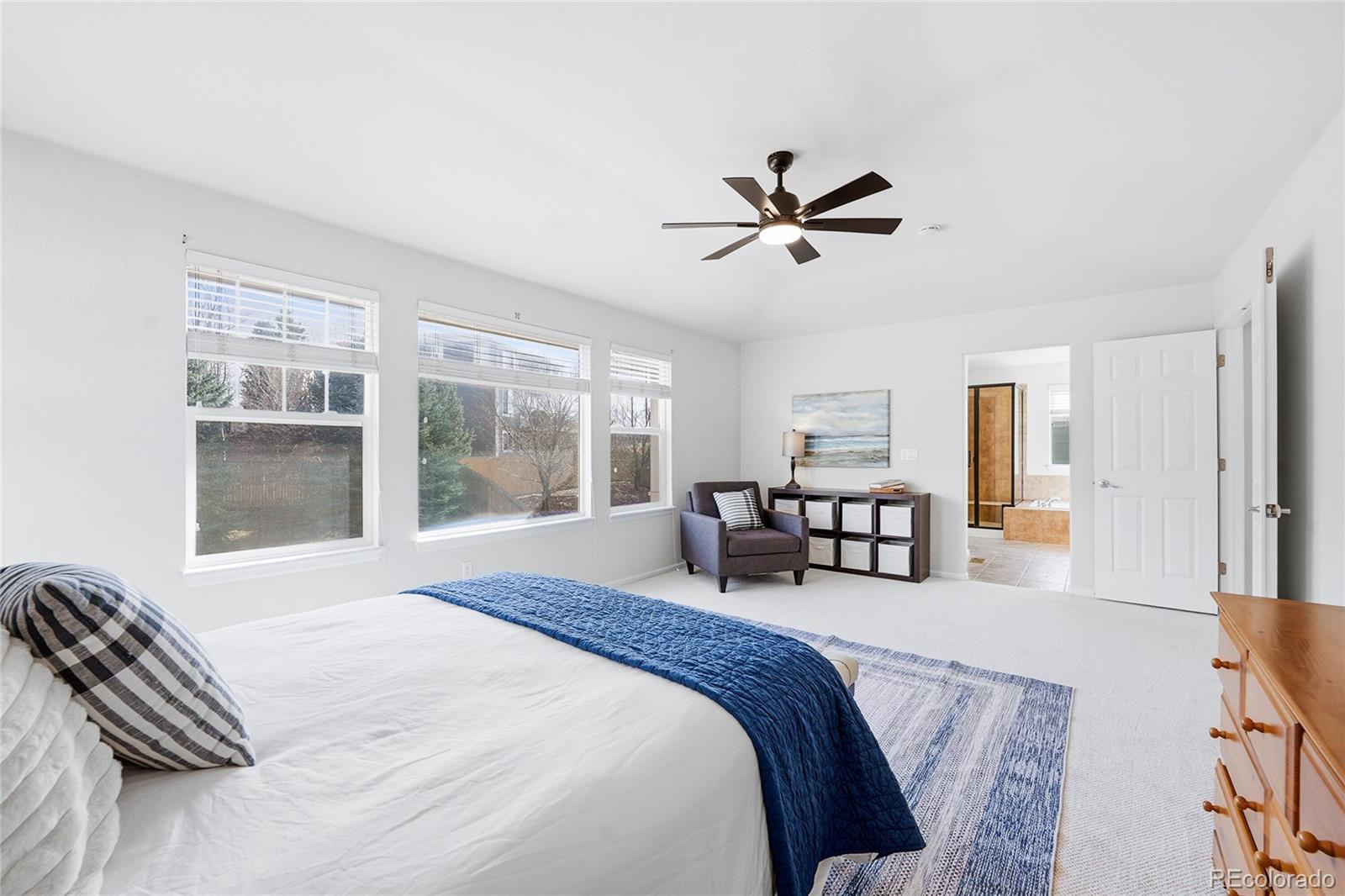 10468 Wagon Highlands Ranch Littleton, CO 80130 - Photo 21 of 48 a bedroom with a bed furniture and a window
