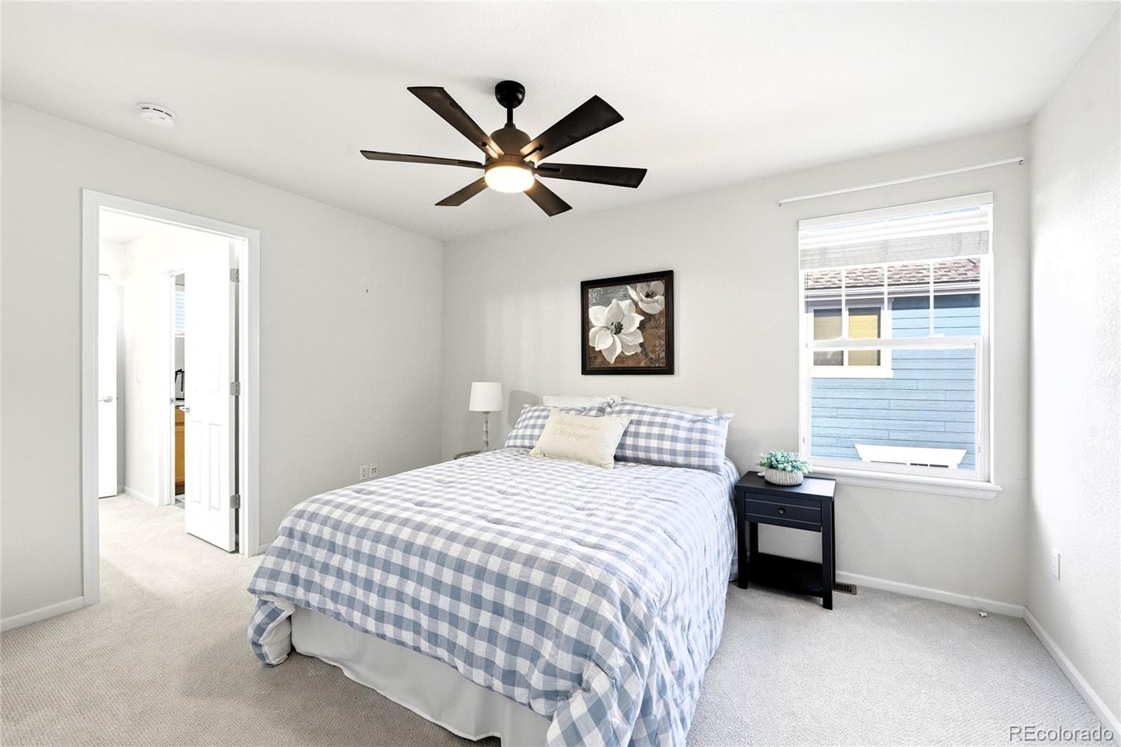 10468 Wagon Highlands Ranch Littleton, CO 80130 - Photo 25 of 48 a bedroom with a bed and a window