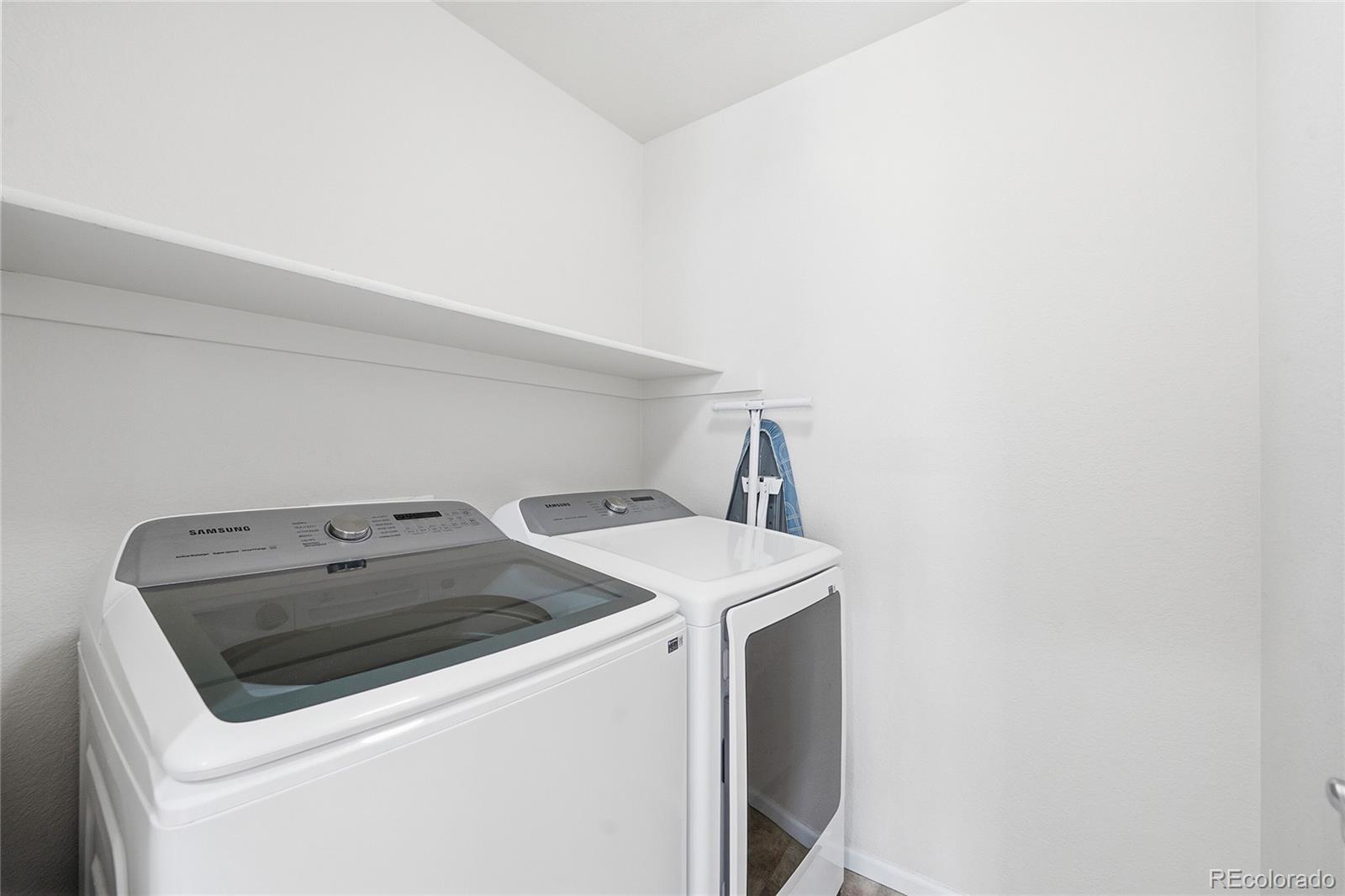 10468 Wagon Highlands Ranch Littleton, CO 80130 - Photo 37 of 48 a utility room with dryer and washer
