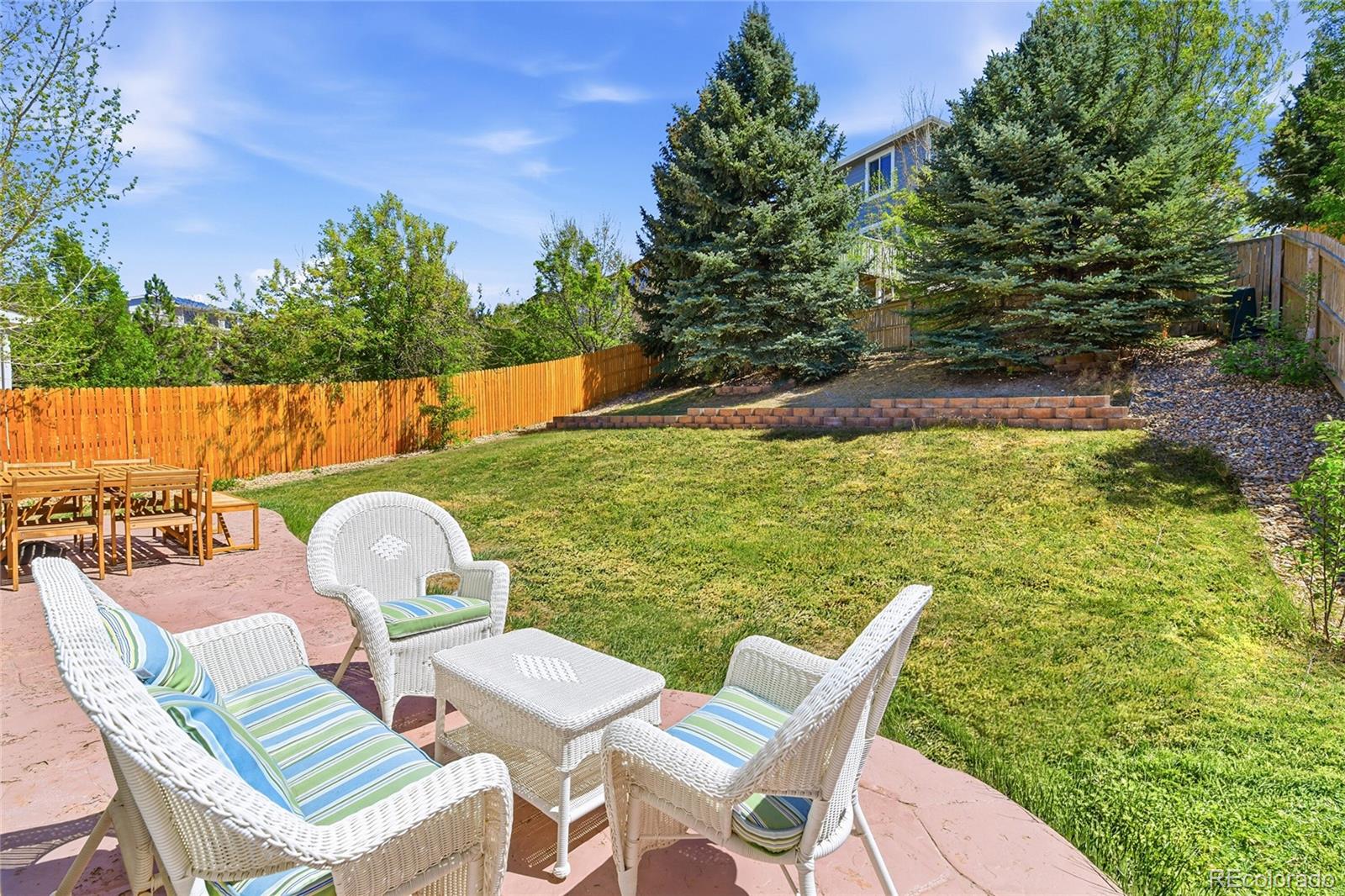 10468 Wagon Highlands Ranch Littleton, CO 80130 - Photo 42 of 48 a view of yard from deck with patio