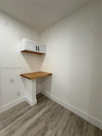 a view of entryway with wooden floor