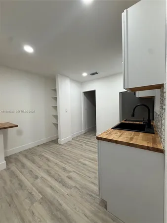 a kitchen with a stove and a refrigerator