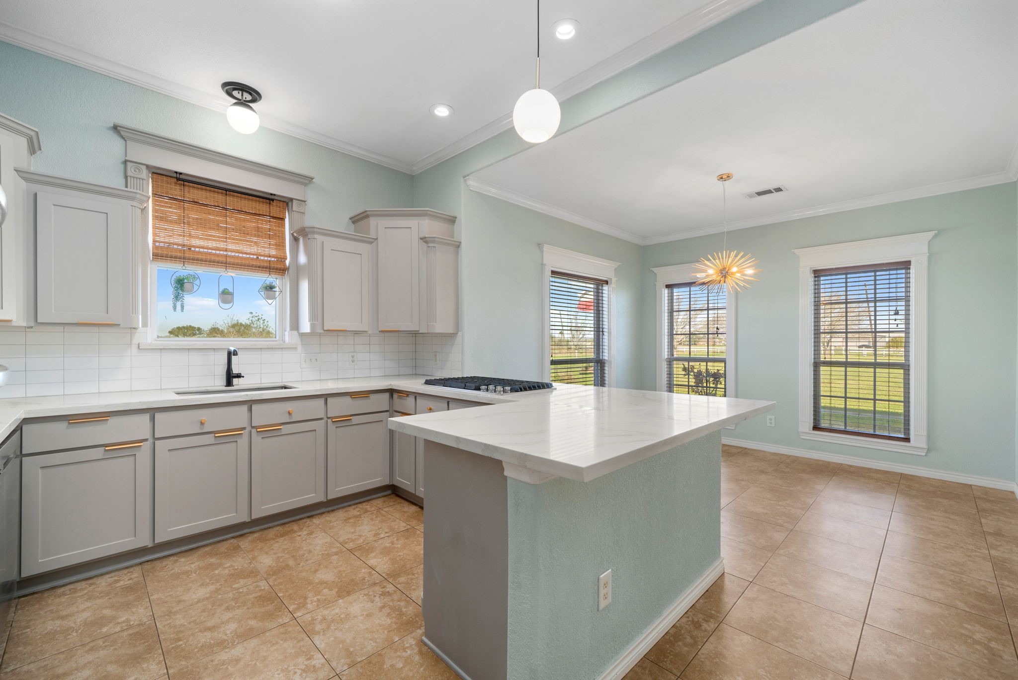 7740 Farm To Market 1462 Rosharon, TX 77583 - Photo 11 of 35 a large kitchen with kitchen island a sink stainless steel appliances and cabinets