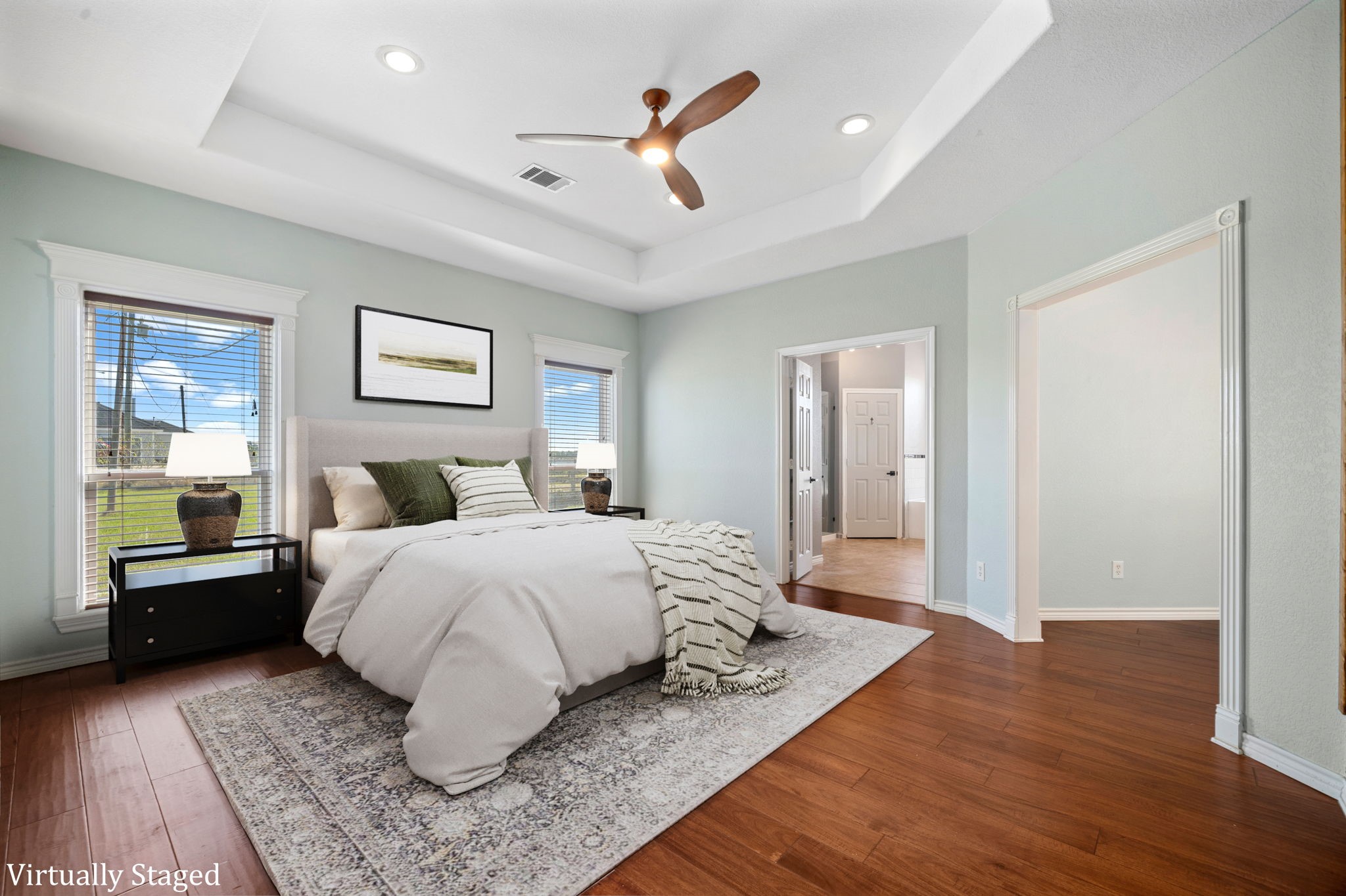 7740 Farm To Market 1462 Rosharon, TX 77583 - Photo 13 of 35 a bedroom with a large bed and a chandelier