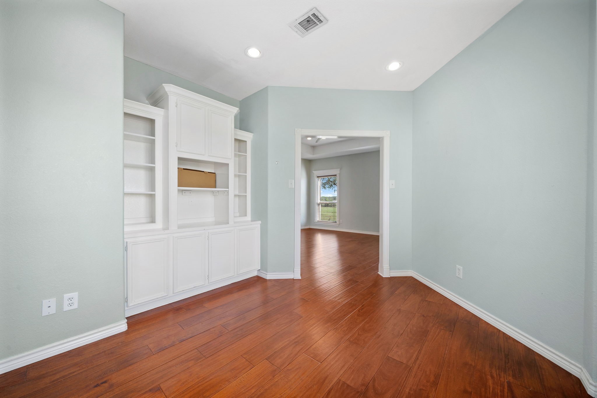 7740 Farm To Market 1462 Rosharon, TX 77583 - Photo 16 of 35 a view of an empty room with wooden floor and a window