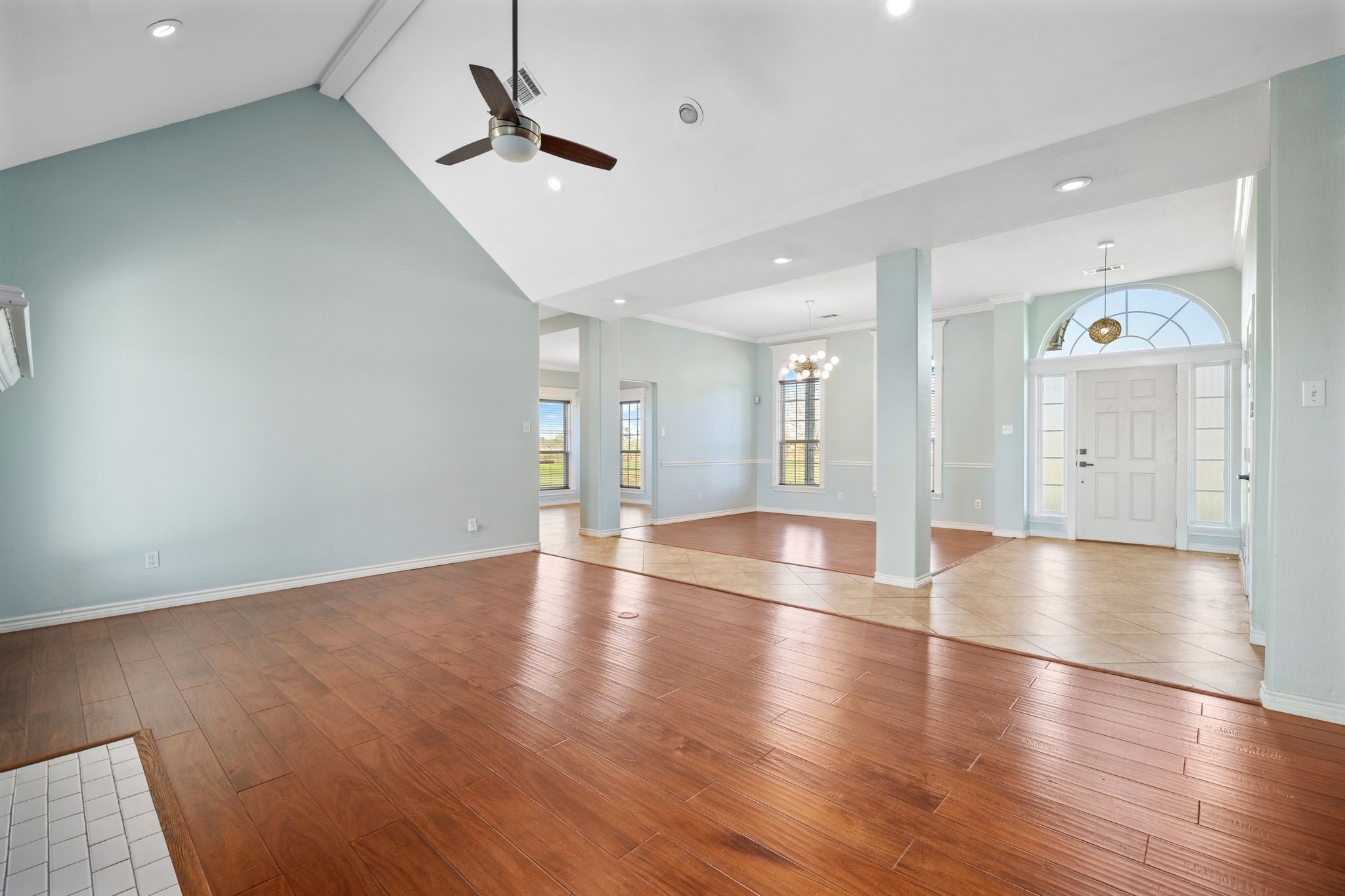 7740 Farm To Market 1462 Rosharon, TX 77583 - Photo 8 of 35 a view of empty room with wooden floor and fan