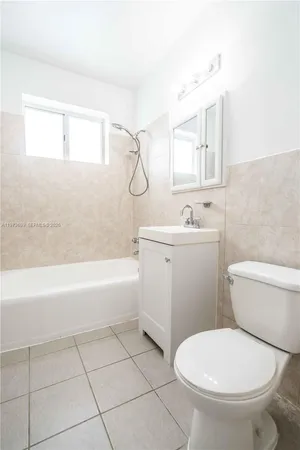 a bathroom with a sink a toilet and a bathtub