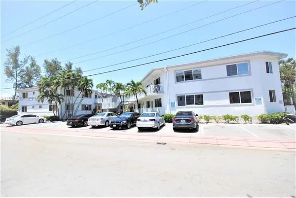 a view of a patio with couches and potted plants