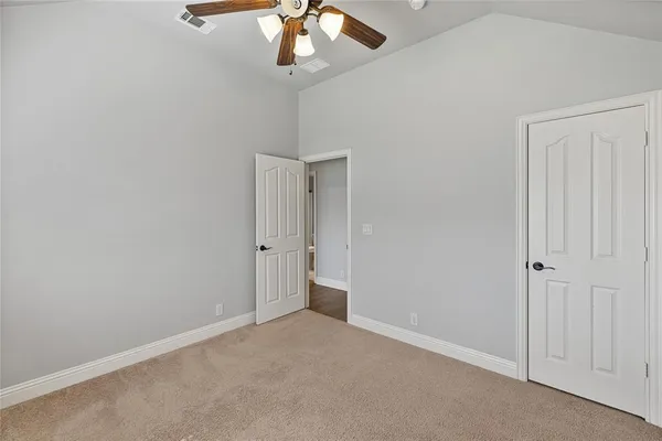 a view of staircase with white walls