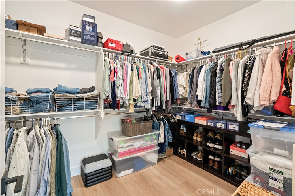 8550 El Corte Road Atascadero, CA 93422 - Photo 30 of 72 a view of walk in closet with clothes and shoes