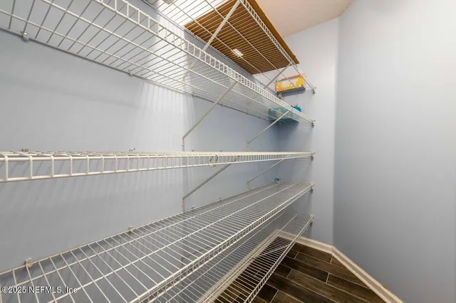 a view of a park with large trees