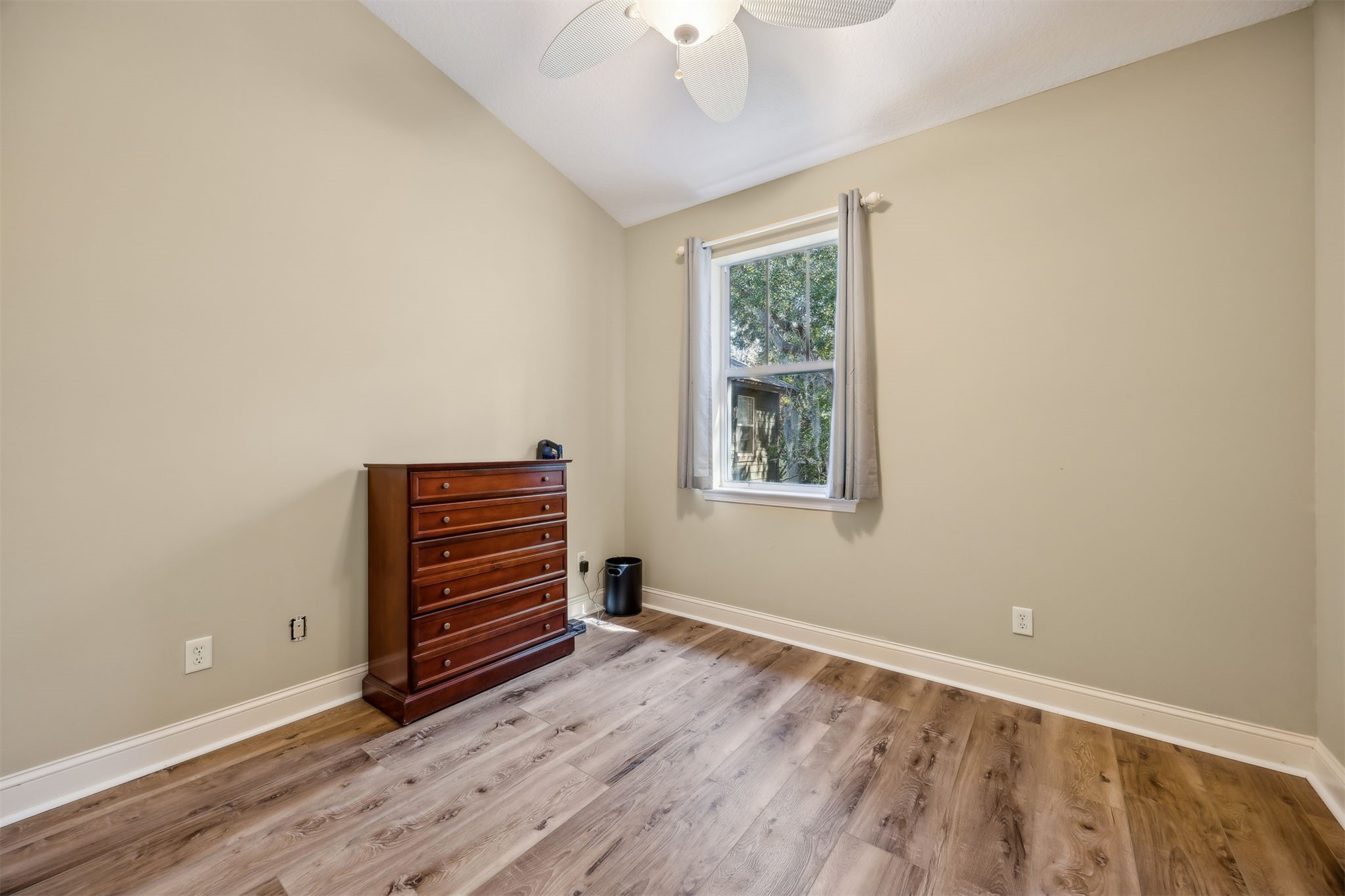 1839 Perimeter Park Road West, Unit 210 Fernandina Beach, FL 32034 - Photo 21 of 37 wooden floor in an empty room with a window