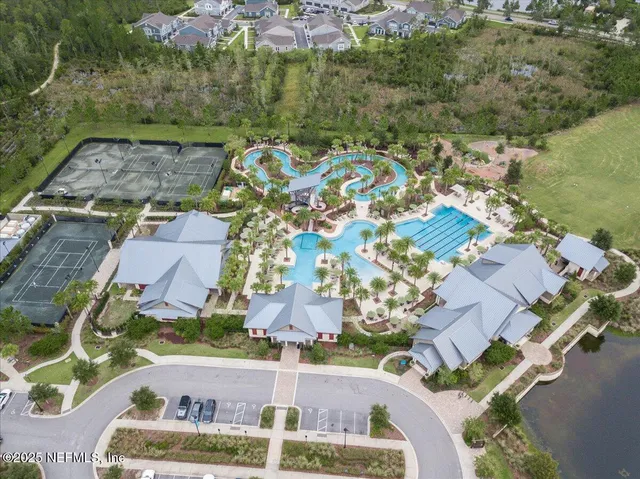 a backyard of a house with a garden and plants