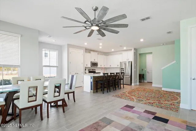 a view of a dining room with furniture
