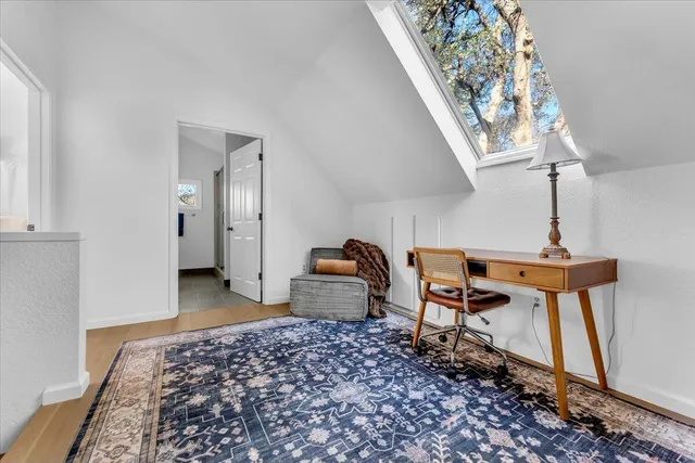 a bedroom with furniture and a window