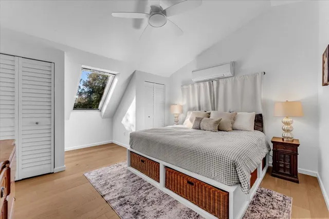 a bed room with a bed and a window