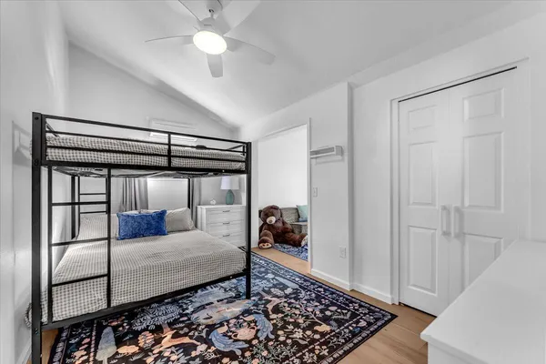 a bedroom with a bed and a walk in closet