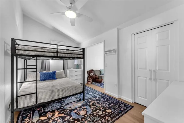 a bedroom with a bed and a walk in closet