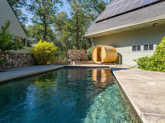 a view of swimming pool with a yard