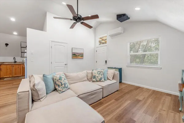 a living room with furniture and a window