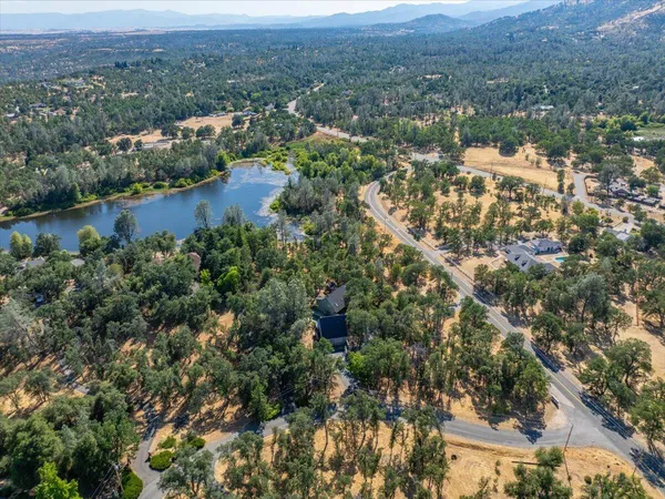 an aerial view of residential house and lake view