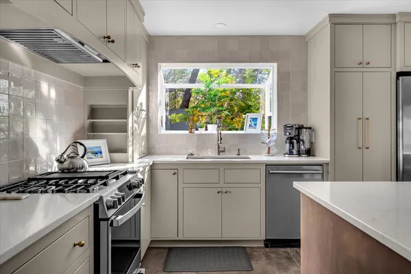 a kitchen with a stove and a sink