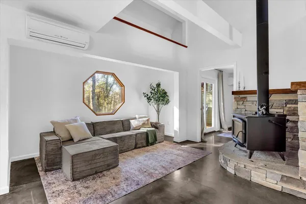 a living room with furniture and a window