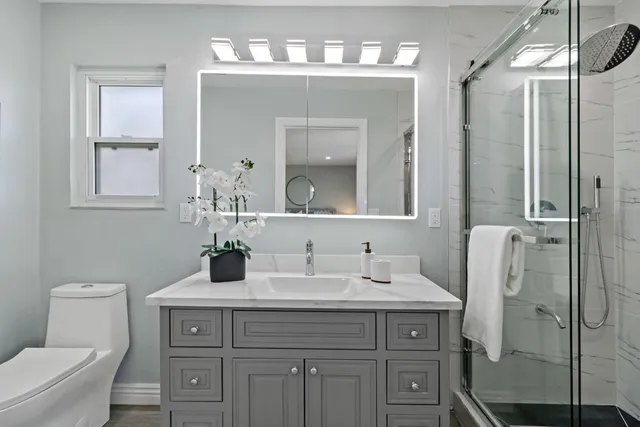 a large kitchen with a wooden floor