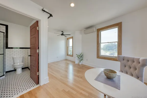 a living room with furniture and a rug