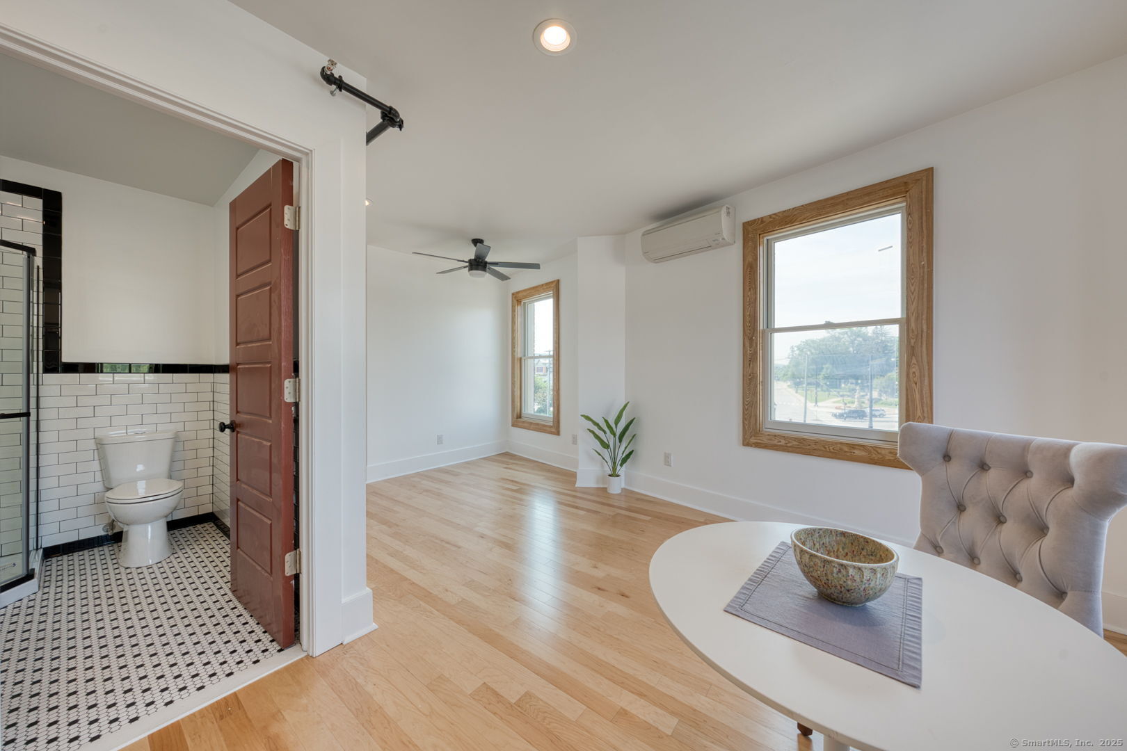 11 Main Street, Unit 202 Torrington, CT 06790 - Photo 7 of 11 a living room with furniture and a rug