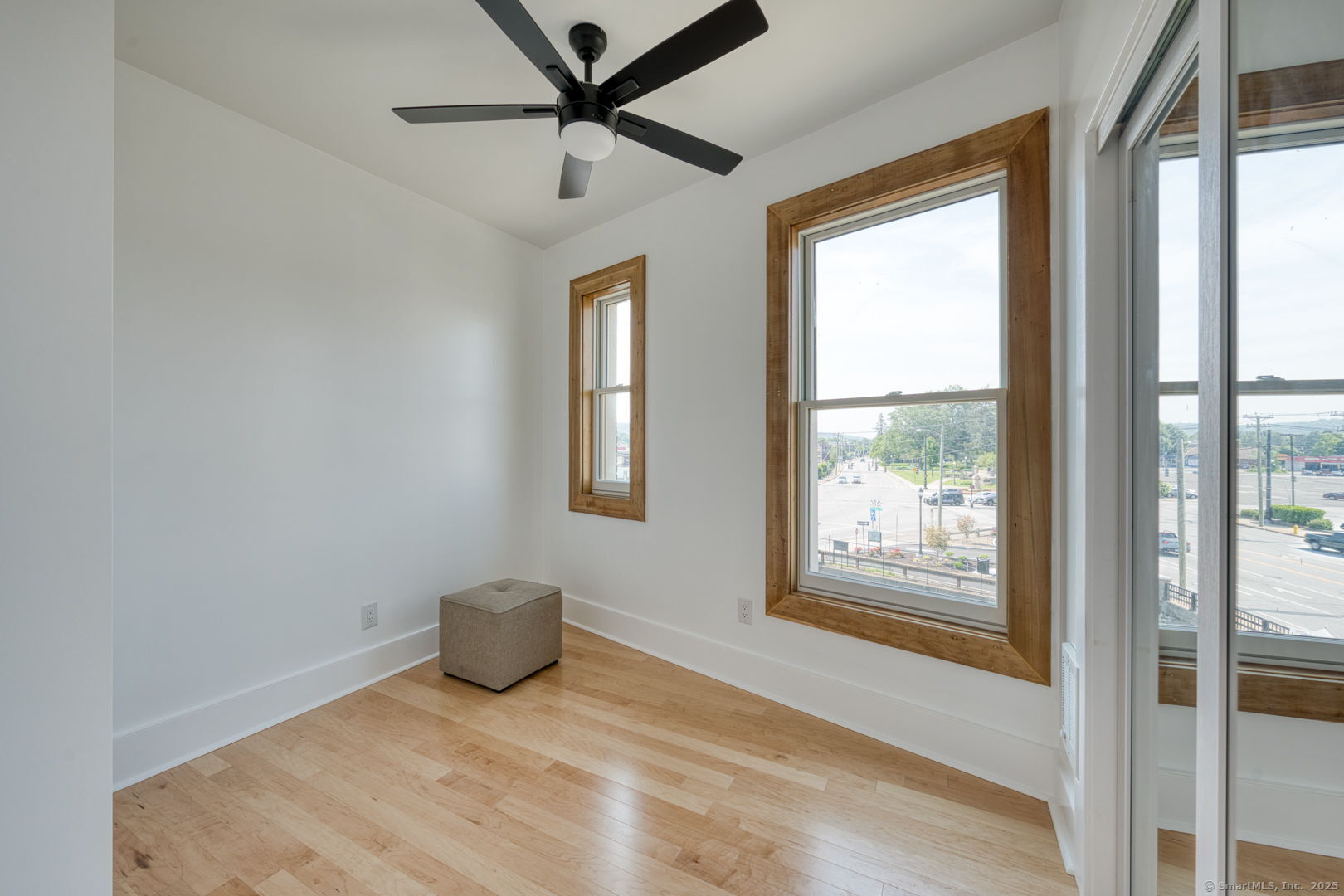 11 Main Street, Unit 202 Torrington, CT 06790 - Photo 9 of 11 a view of a livingroom with a fireplace and a window