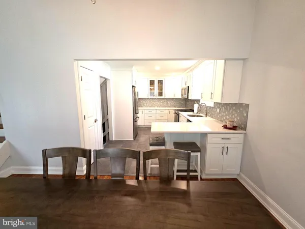 a kitchen with a sink stove and refrigerator
