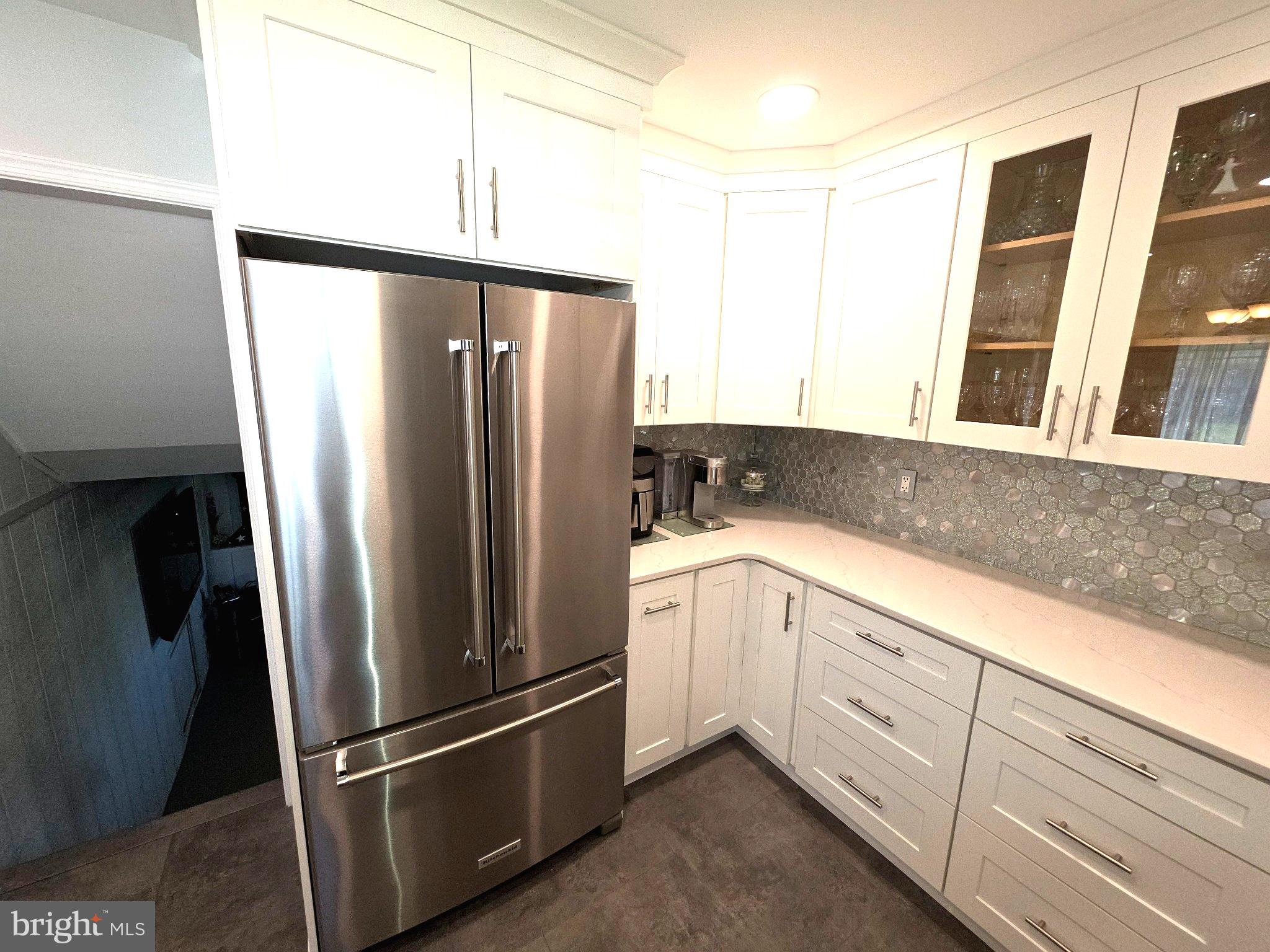 156 Crockett Road Warminster, PA 18974 - Photo 25 of 57 a kitchen with stainless steel appliances granite countertop a refrigerator and a sink